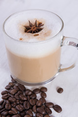 Coffee cup on grunge white wooden background