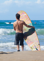 Naklejka na ściany i meble Portrait of Surfer with longboard