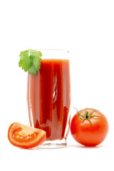 Tomato juice in a glass with green leaf with tomato near isolated on white background
