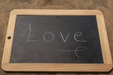 Love written under blackboard