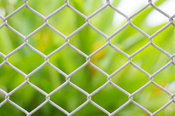Fototapeta premium mesh fence closeup on blur backgroun