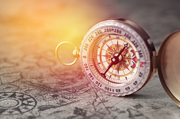 Fototapeta na wymiar vintage compass on old map