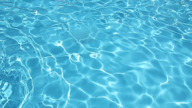 Background of  clean water in a blue swimming pool