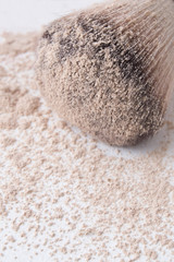 macro shot of makeup powder on brush,close up makeup powder on brush