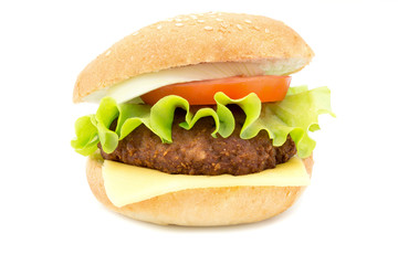 hamburger with fresh leaf lettuce cheese slice chop tomatoes and onion rings isolated on white background 
