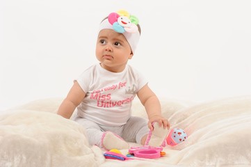 Cute and happy newborn baby playing, smiling, laughing with great pose