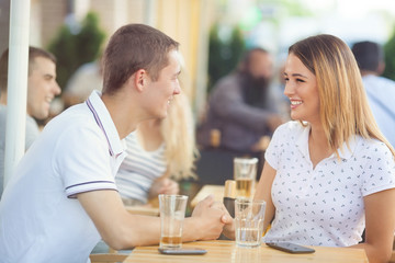 Romantic young couple sitting in a cafe