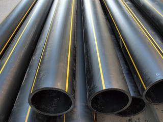 Black plastic PVC pipes on the street