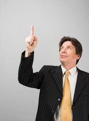 man shows his index finger up