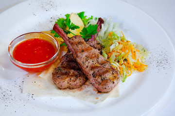 roasted meat with vegetables and spicy sauce