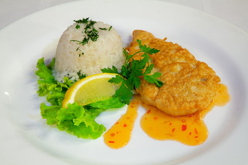 roast meat with rice and vegetables