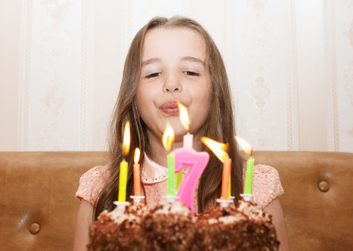 Little Girl Blowing Out The Candles