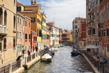 Fototapeta na wymiar ITALY, VENICE - September 7: Narrow canal view with boats in Ven
