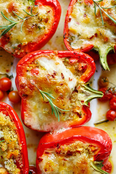 Roasted peppers stuffed with quinoa, vegetables and cheese.