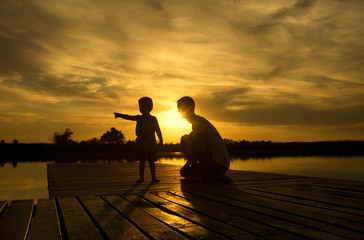 Family sunset on the lake