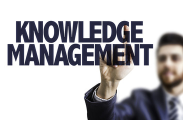 Business man pointing the text: Knowledge Management