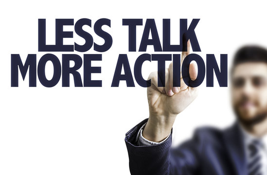 Business man pointing the text: Less Talk More Action