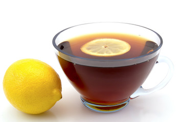 tea with lemon in a transparent cup isolated on a white background
