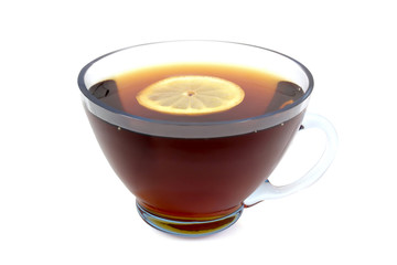 tea with lemon in a transparent cup isolated on a white background
