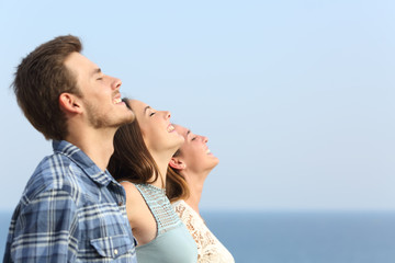 Group of friends breathing deep fresh air