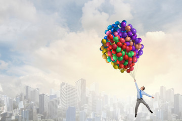 Businessman flies in sky