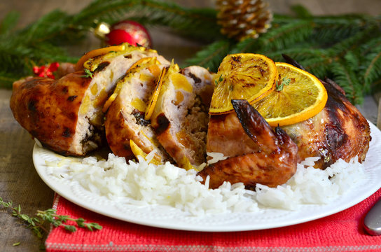 Grilled chicken stuffed with dried fruits in honey and orange gl