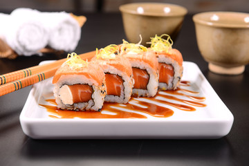 Salmon Sushi with leek straw on top