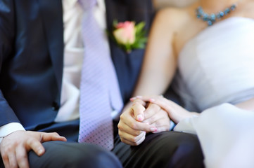 Bride and groom holding hands