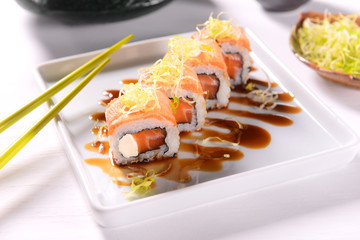 Salmon Sushi with leek straw on top