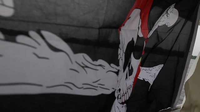 Jolly Roger waving in the wind \ Pirate flag Jolly Roger waving in the wind