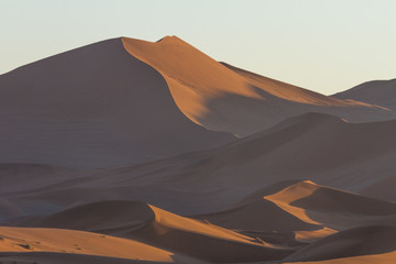 Fototapeta na wymiar Sunrise at the dunes near Sossousvlei, Namibia, Namib Desert, Africa.