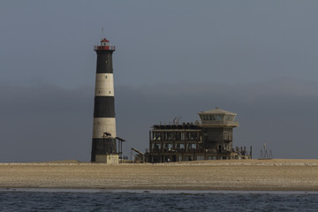 Lighthouse on Pelican Point overlooking Walvis Bay, Namibia. The lighthouse was built in 1932 and...