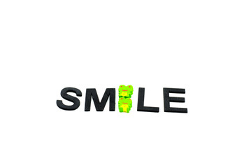 three emoticons, green frog look eraser  and form word smile isolated white background