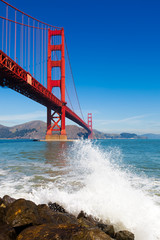 Golden Gate Bridge with spray from ocean wave - in San Francisco