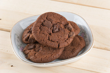 soft dark chocolate brownie cookies on wood