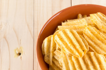 potato chips on wood background