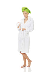 Spa woman in bathrobe and turban.