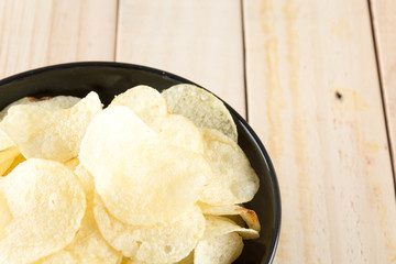 potato chips on wood background