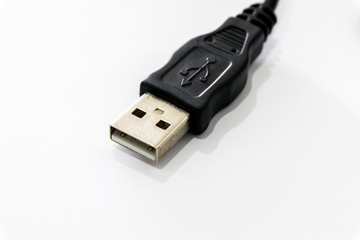 Black USB connector isolated on white background.