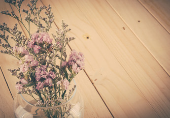 statice flower bouquet  on wood background