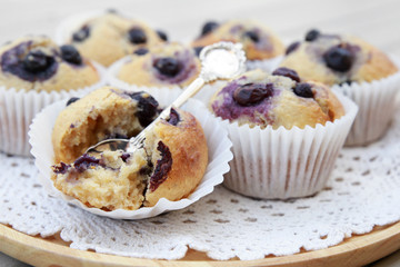 Homemade wholemeal coconut blueberry muffins with spoon