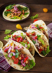 Mexican tacos with meat, beans and salsa