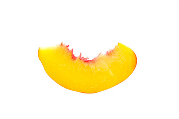 slice of peach close-up isolated on white background