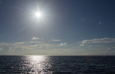 The bright tropical sun over the ocean
