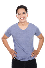 Young asian man posing hands on the waist, smile to the camera