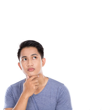 Young Asian Man Thinking Looking Up Isolated