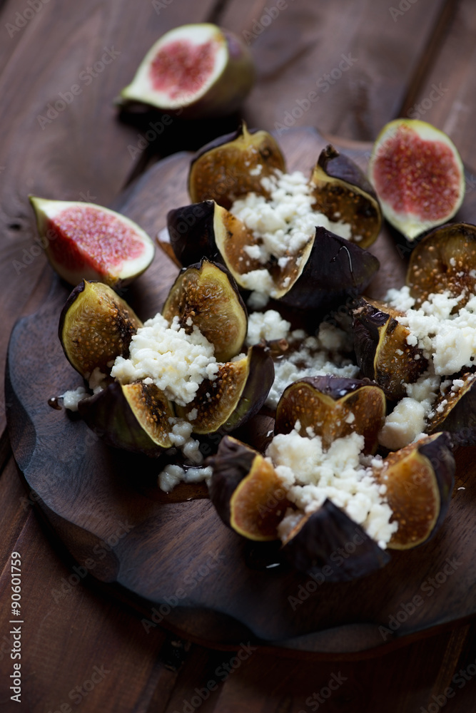 Poster Close-up of baked fig fruits with cottage cheese and honey