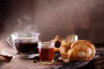 breakfast hot coffee  with honey and croissant