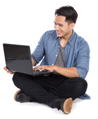 Young asian man using laptop, isolated in white background
