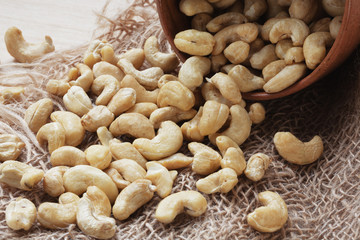 Cashew nuts on bagging background